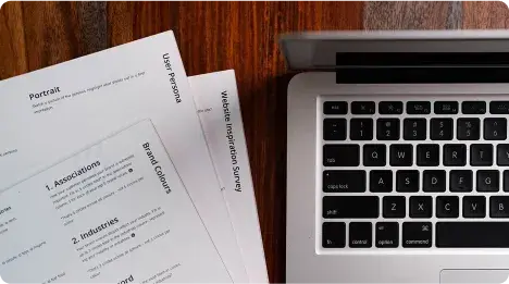 Printed documents beside a laptop: which copy is the current one Printed documents beside a laptop: which copy is the current one