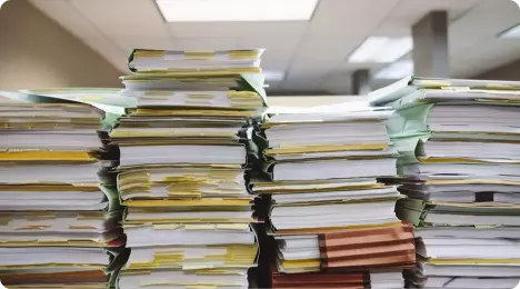 Stacks of files waiting for a retention term and a disposal decision Stacks of files waiting for a retention term and a disposal decision